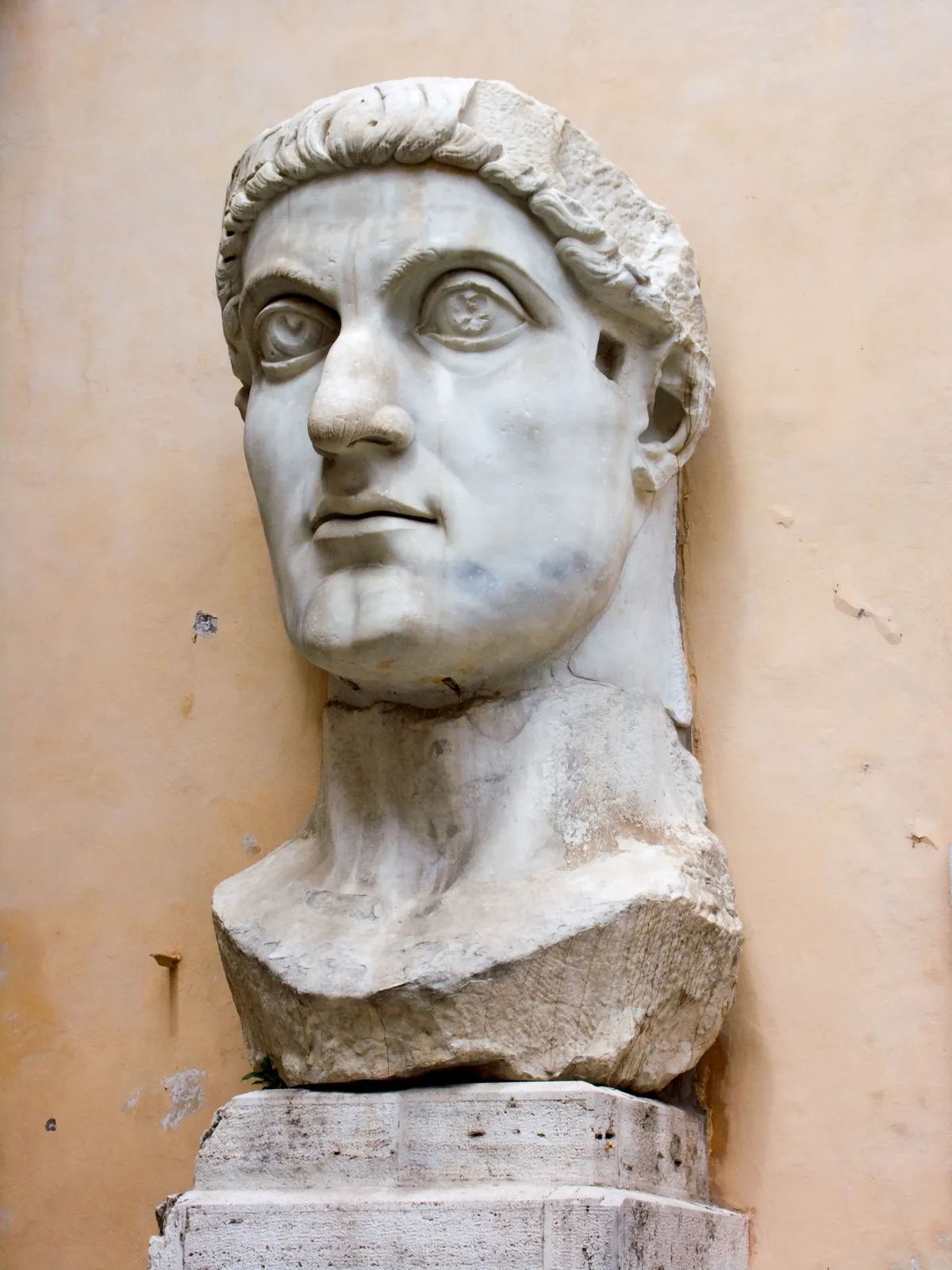 The colossal marble head of Constantine the Great, from the acrolithic seated statue in the Basilica of Maxentius, now in the courtyard of the Palazzo dei Conservatori, Rome.