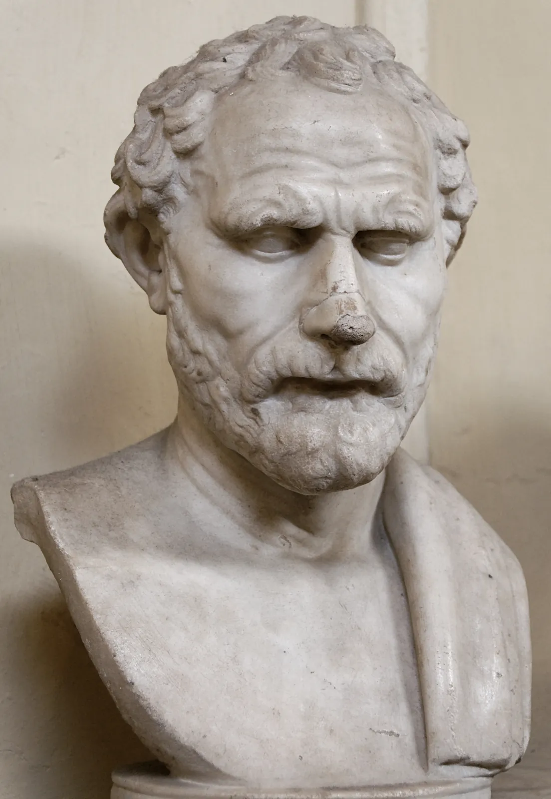 Marble portrait head of Demosthenes, a Roman copy after the bronze statue by Polyeuktos, the orator's brow furrowed in the characteristic look of care.