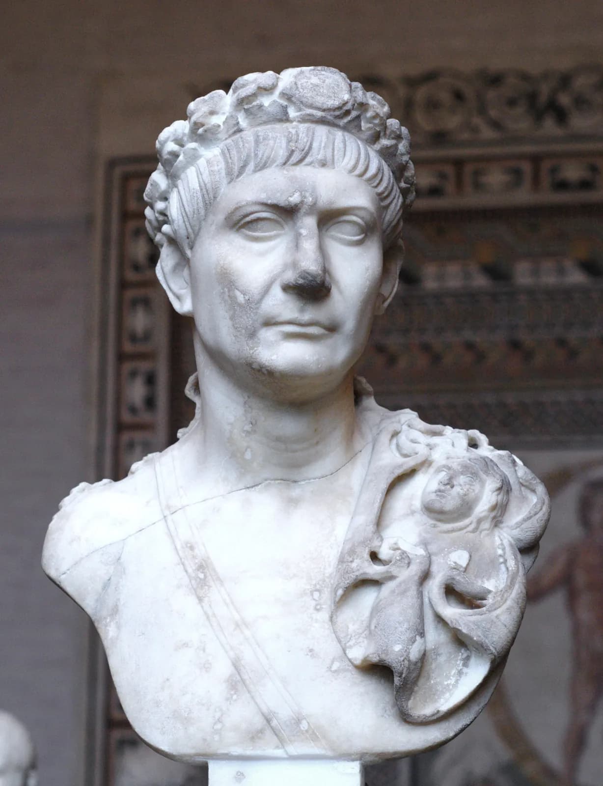 Marble bust of the Emperor Trajan wearing the civic crown, aegis and sword-belt, Glyptothek Munich, early 2nd century CE.